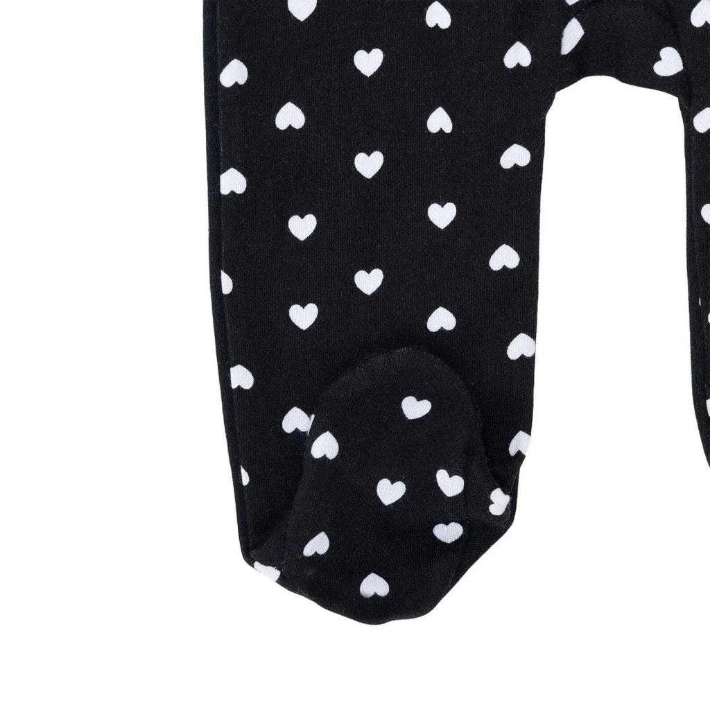Black footed baby sleepsuit with white hearts, covered toes
