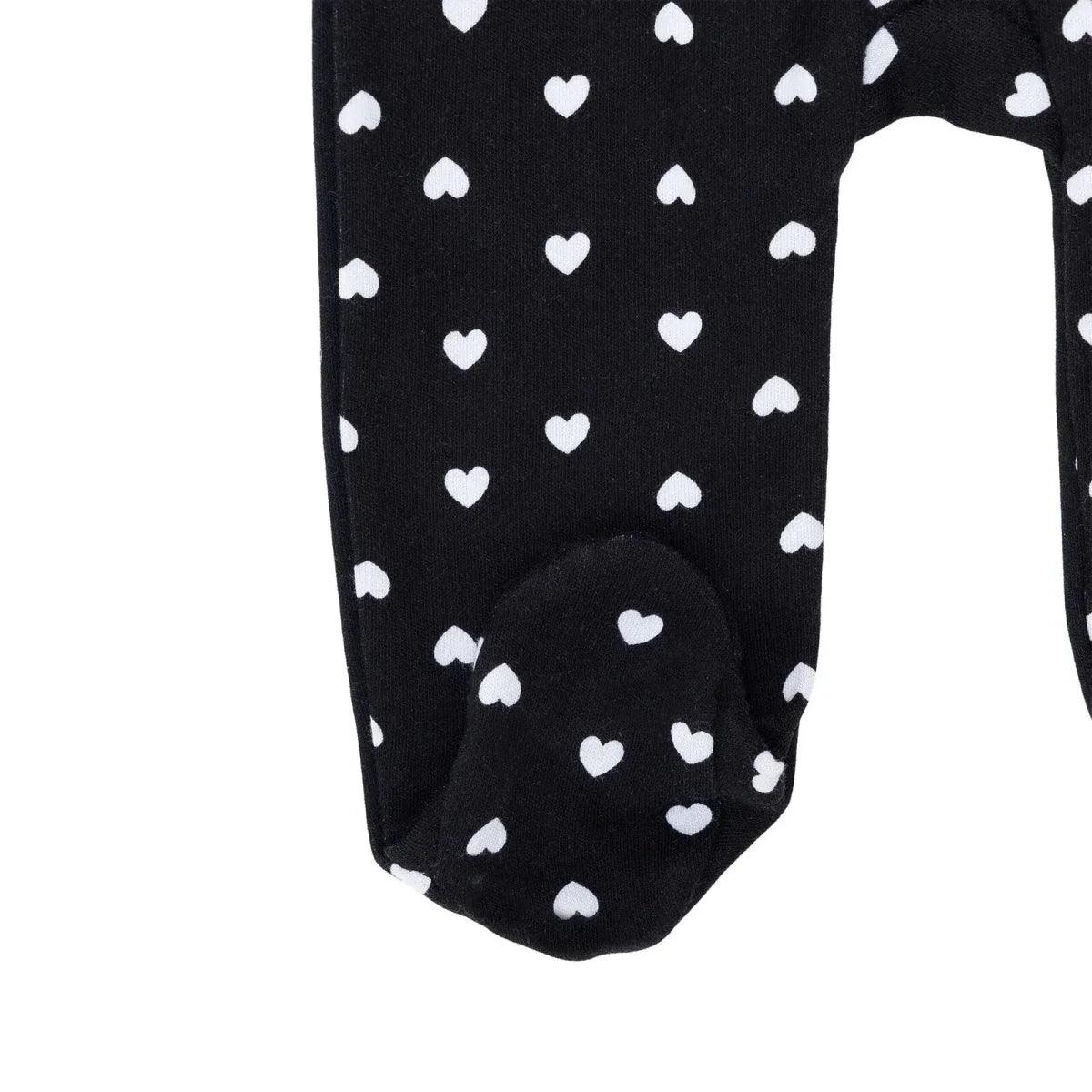 Black footed baby sleepsuit with white hearts, covered toes
