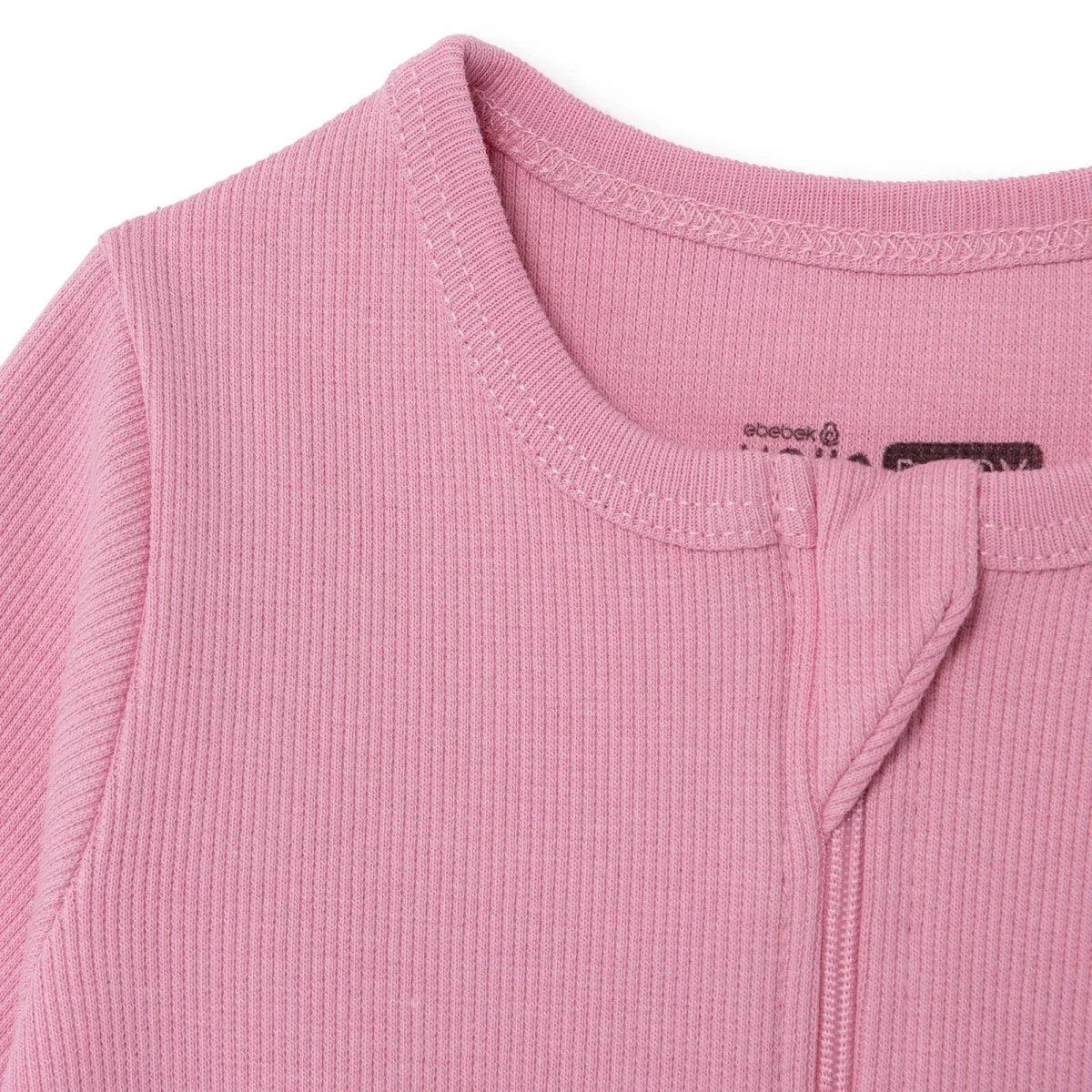 Pink ribbed footed baby sleepsuit with zip placket and soft crew neck