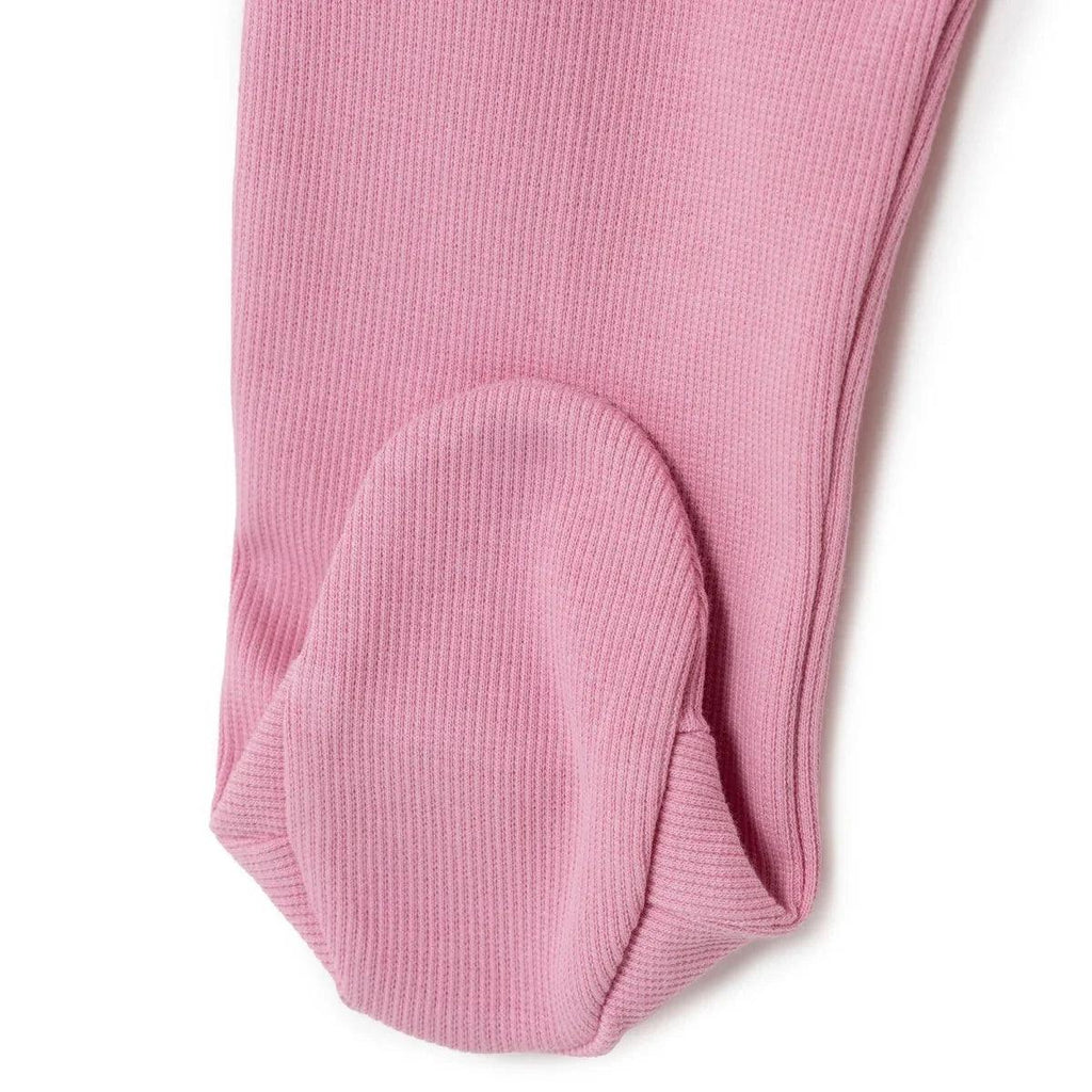 Pink ribbed foot opening on a footed baby sleepsuit