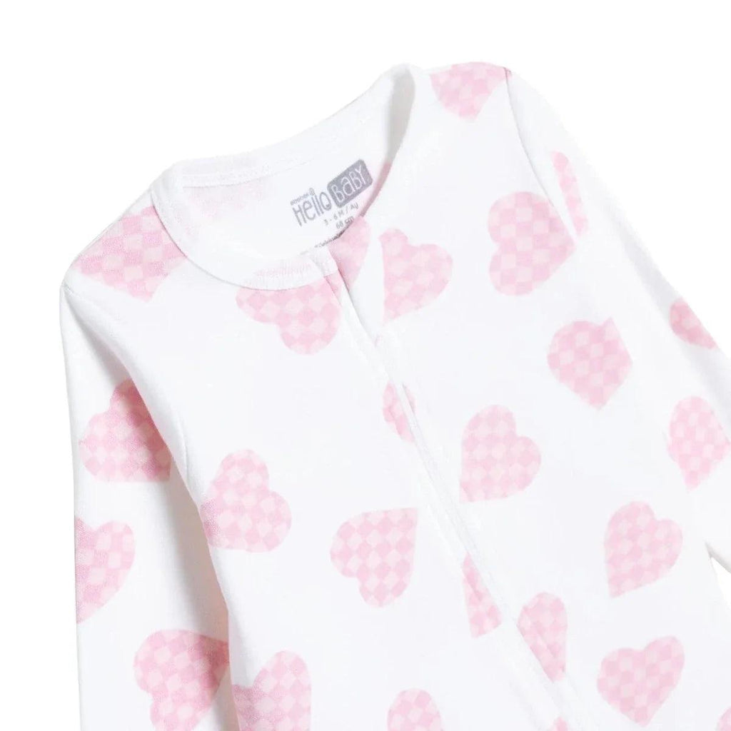 Baby sleepsuit neckline and front opening, white with pink heart print