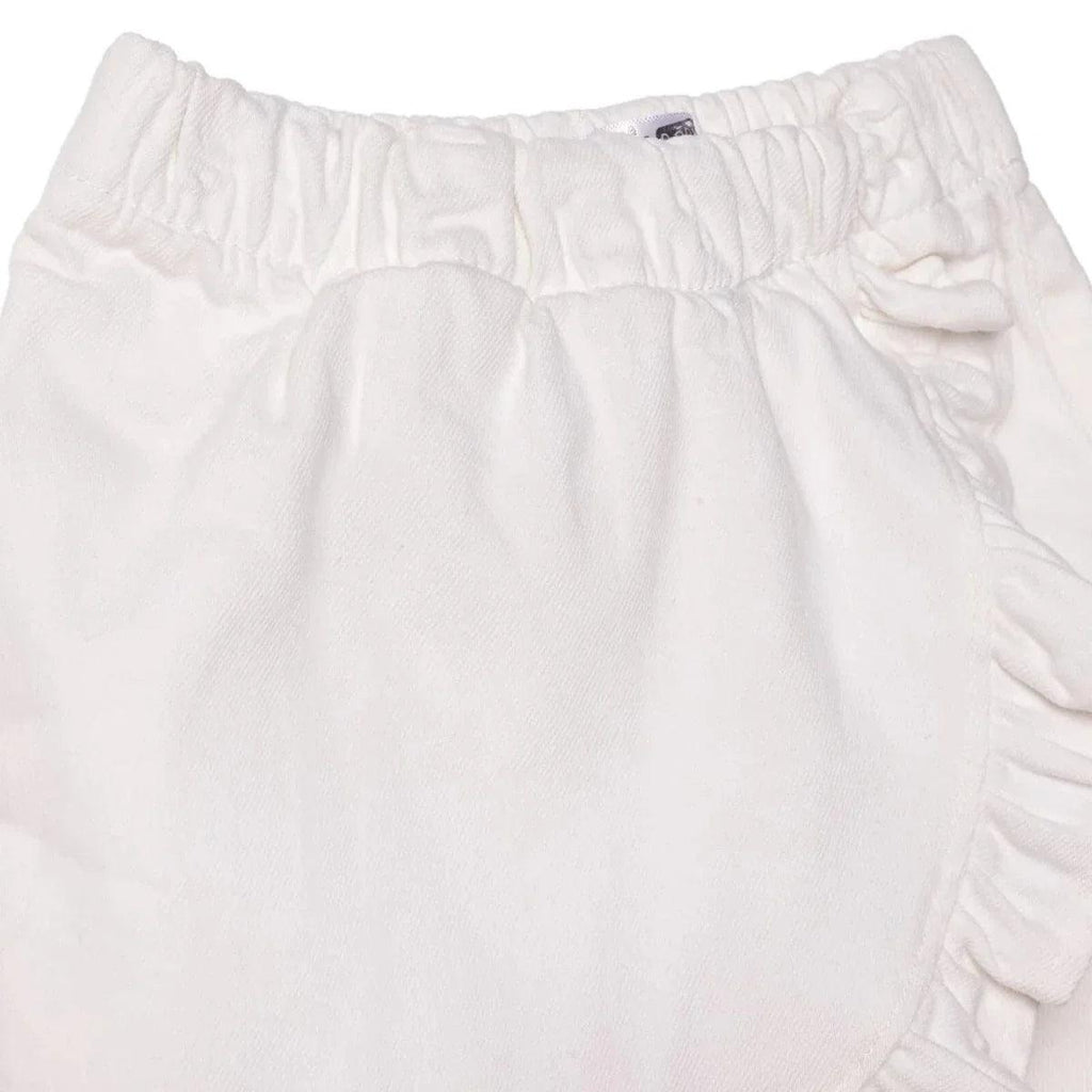 Ecru baby skort close-up of elastic waistband with gathered skirt overlay