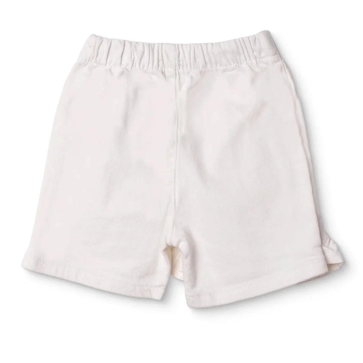Ecru baby skort with elastic waistband and flared skirt panels, built-in shorts
