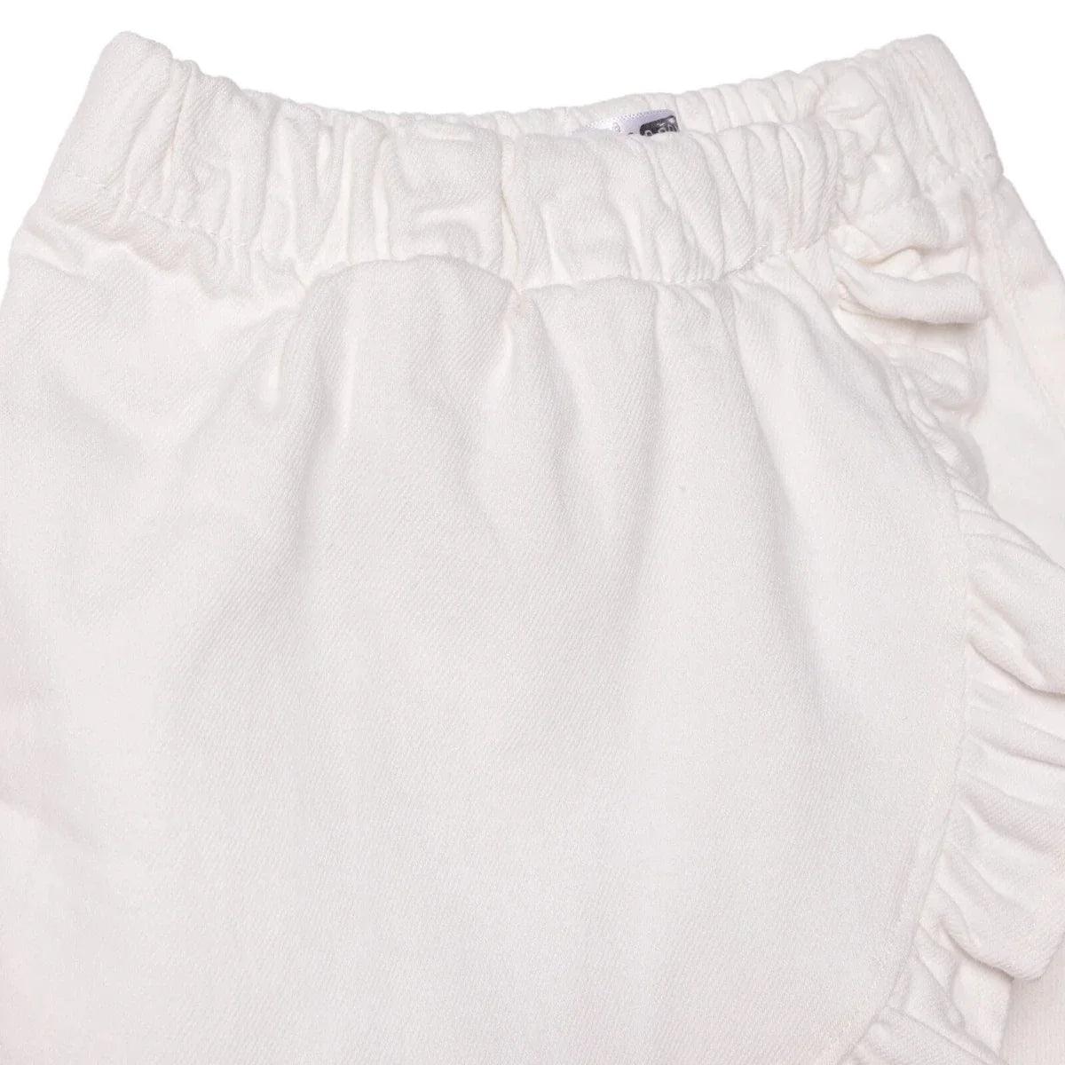 Ecru baby skort close-up of gathered skirt fabric and elastic waistband
