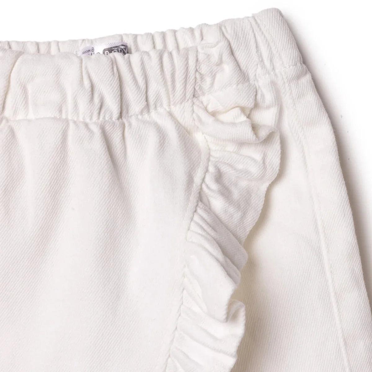Ecru baby skort close-up of waistband stitching and side ruffle trim
