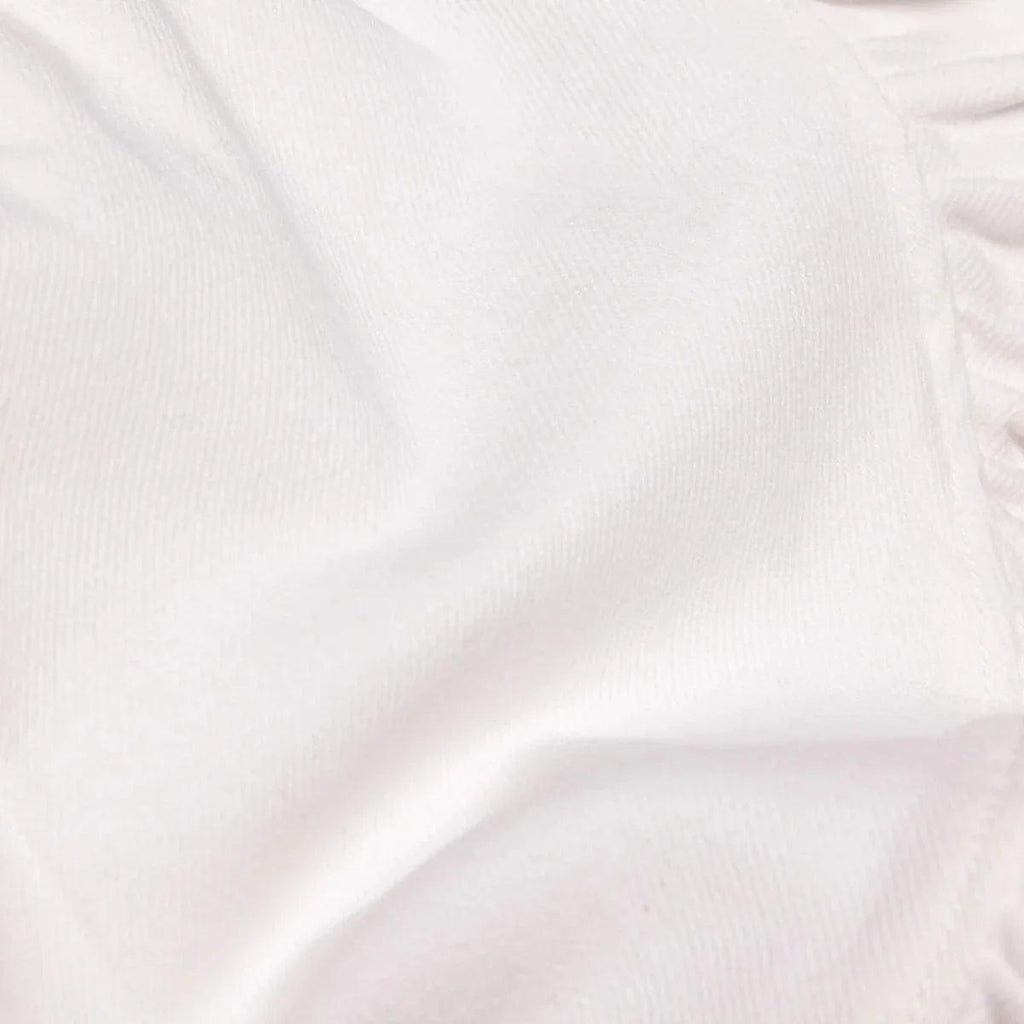 Close-up of ecru fabric for plain baby skort