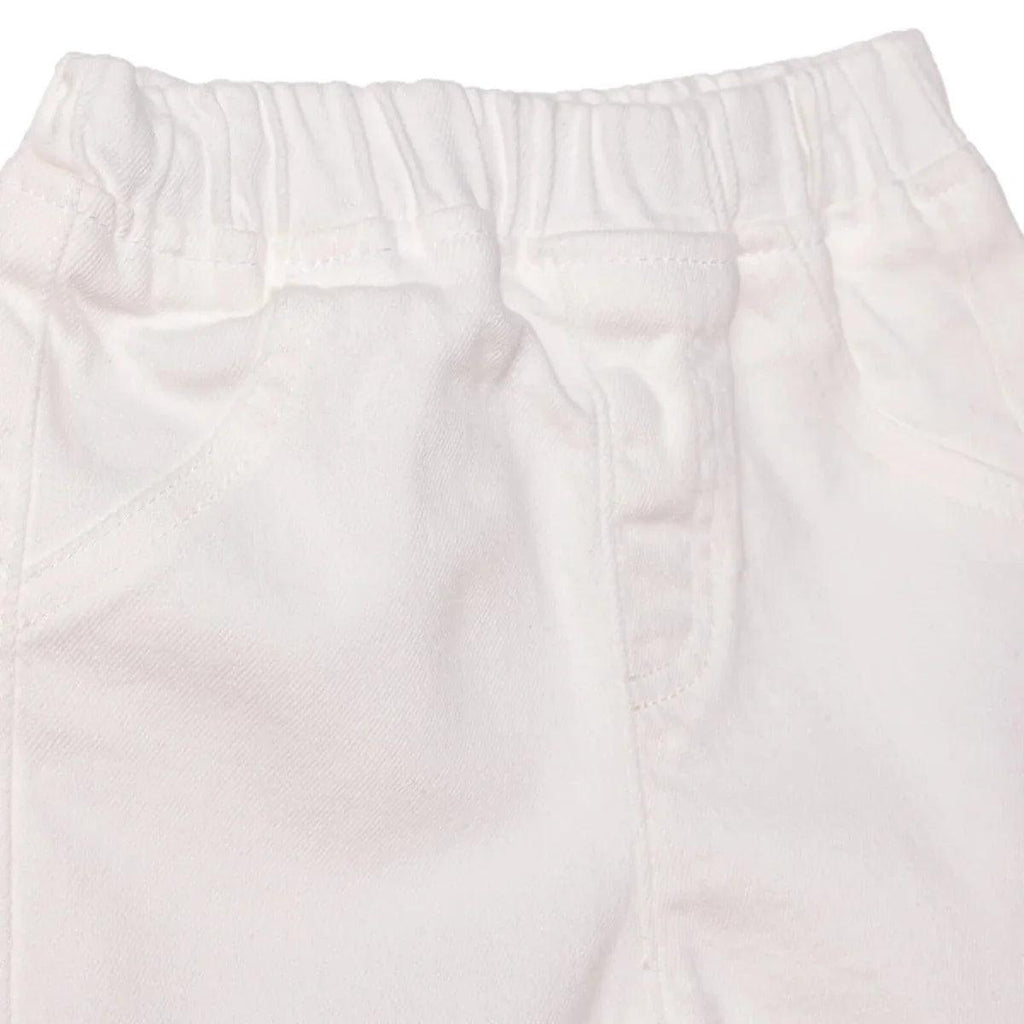 Ecru denim baby shorts close-up of elastic waist and front seams