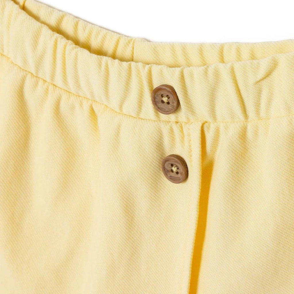 Yellow baby skort waistband with two buttons and button placket