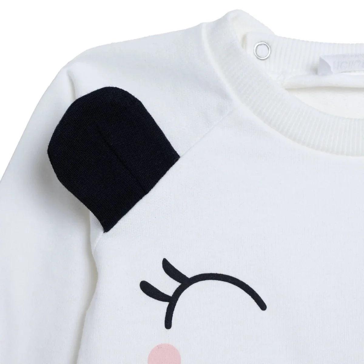 Ecru baby sweatshirt close-up with black ear patch and round snap neckline
