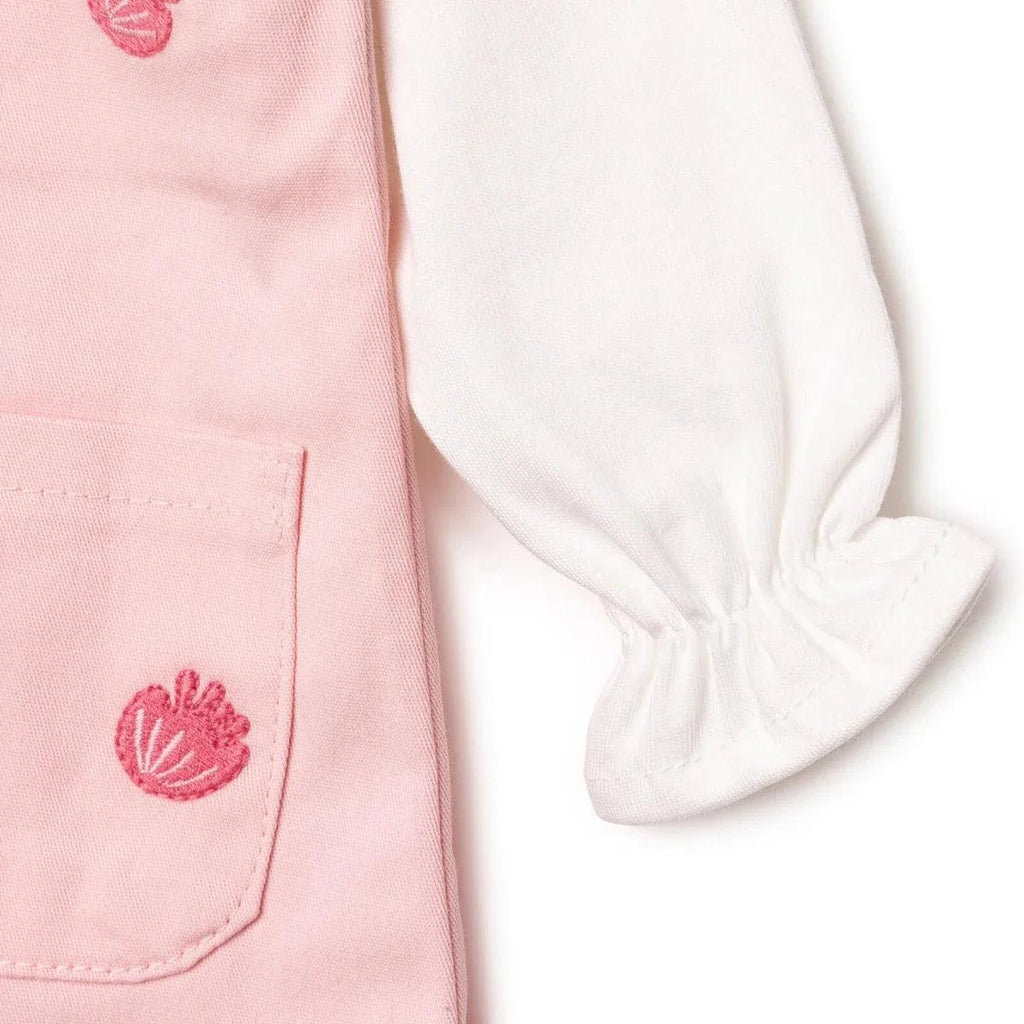 Pink dungarees with front pocket and white long-sleeve cuff with gathered hem
