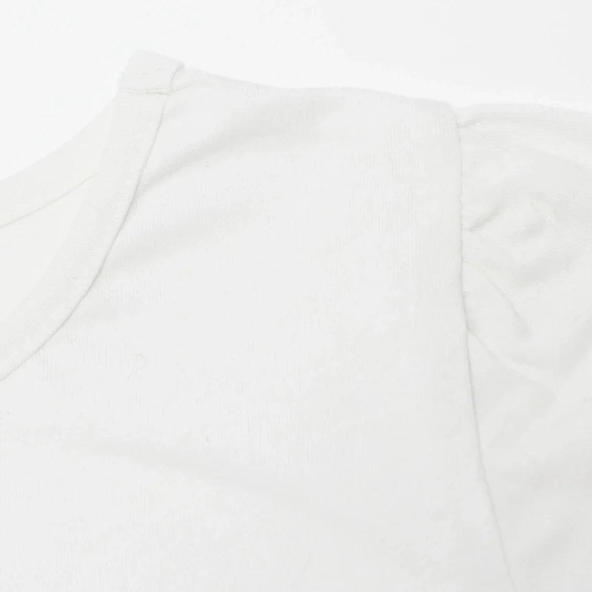 Ecru baby top with short sleeve seam and rounded neckline