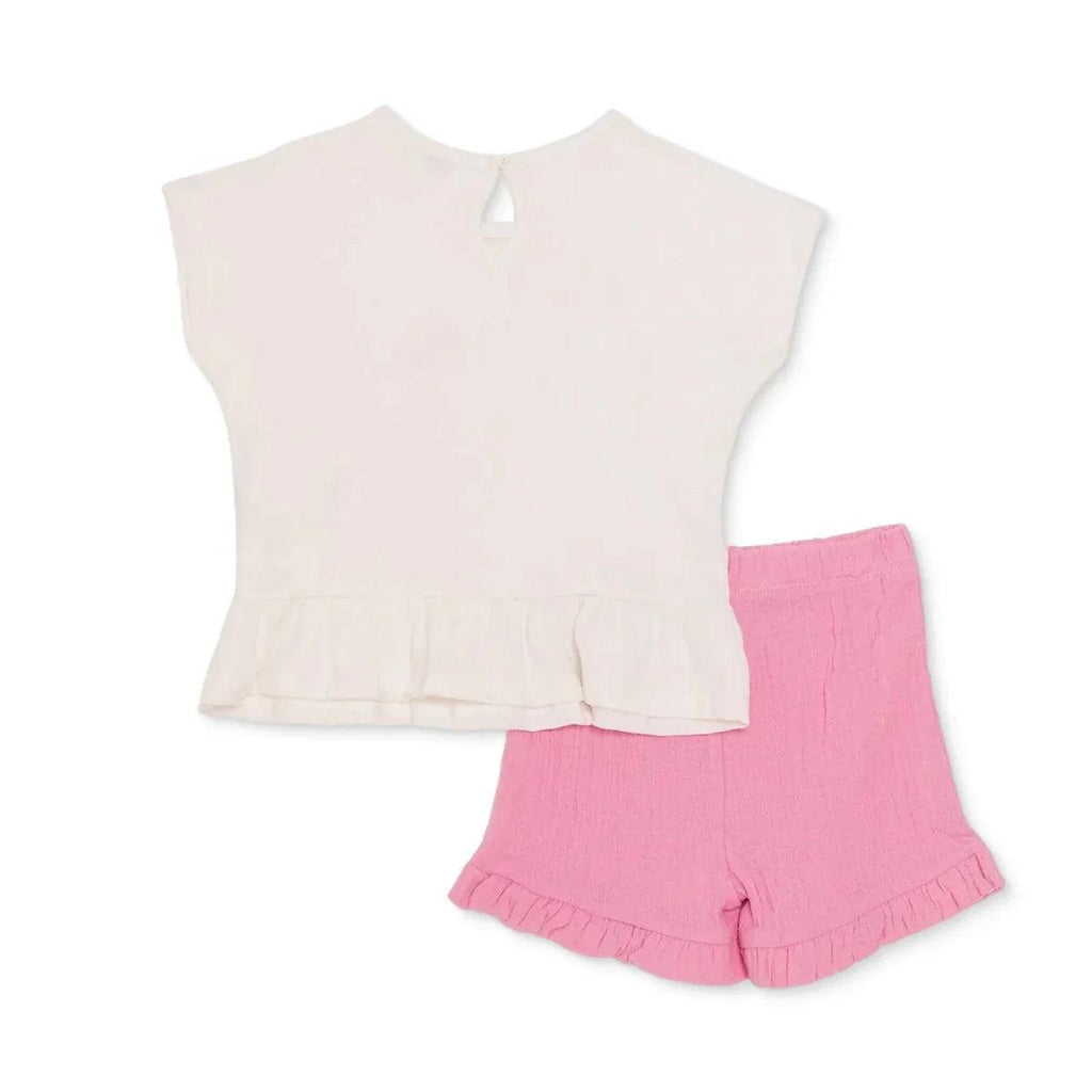Ecru baby t-shirt with keyhole neck and pink ruffle shorts.