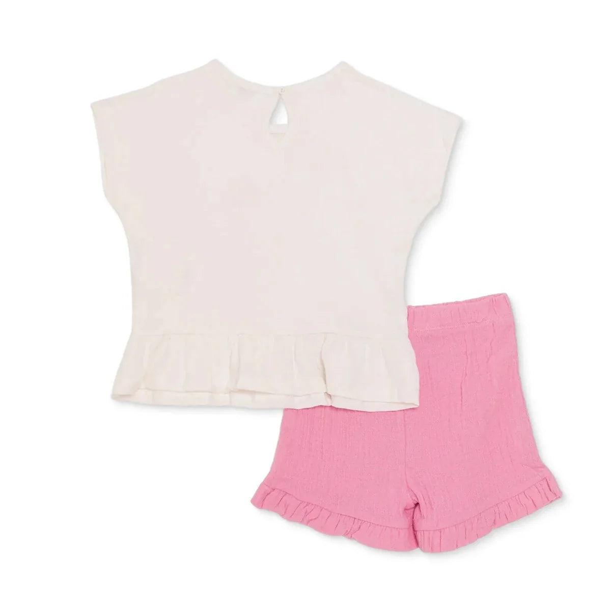 Ecru baby t-shirt with keyhole neck and pink ruffle shorts.