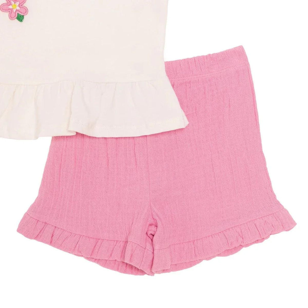 Pink baby shorts with elastic waist and ruffled hem.