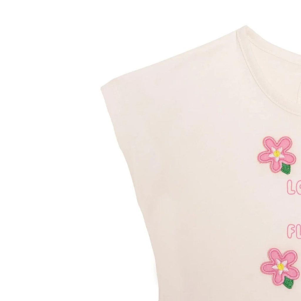 Ecru baby t-shirt with pink flower applique graphic on the front.