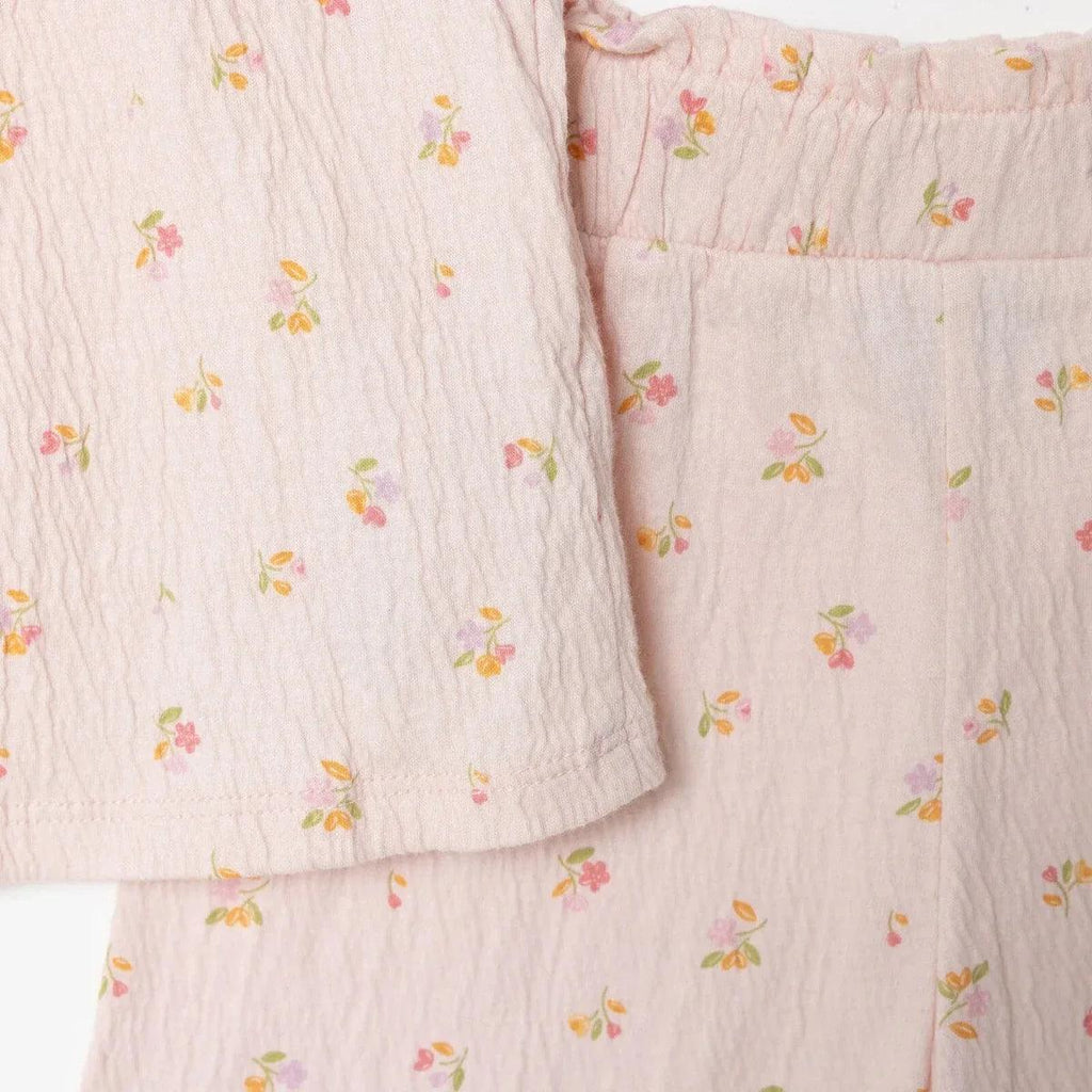 Pink floral baby shorts close-up, elastic waistband and gathered front