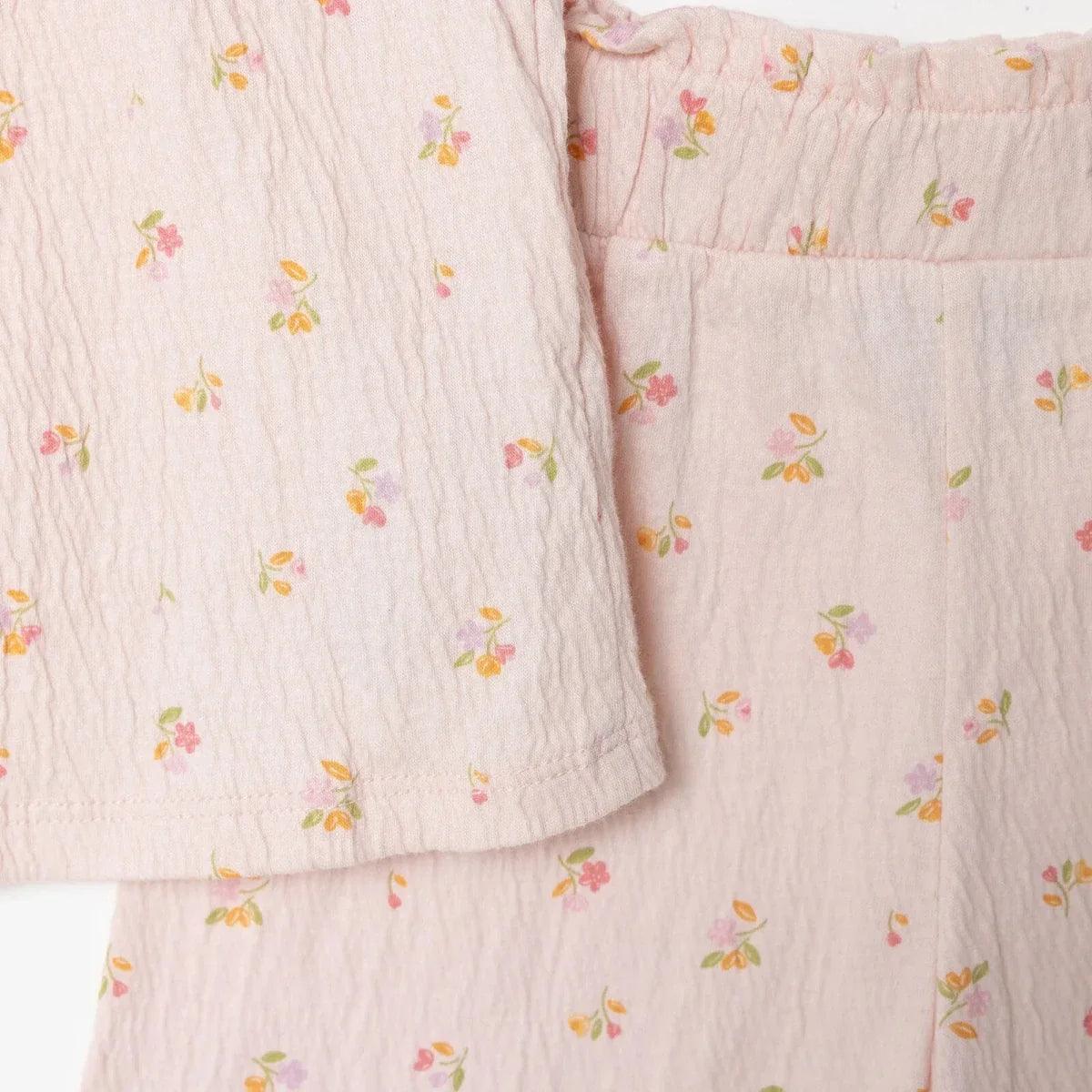 Pink floral baby shorts close-up, elastic waistband and gathered front