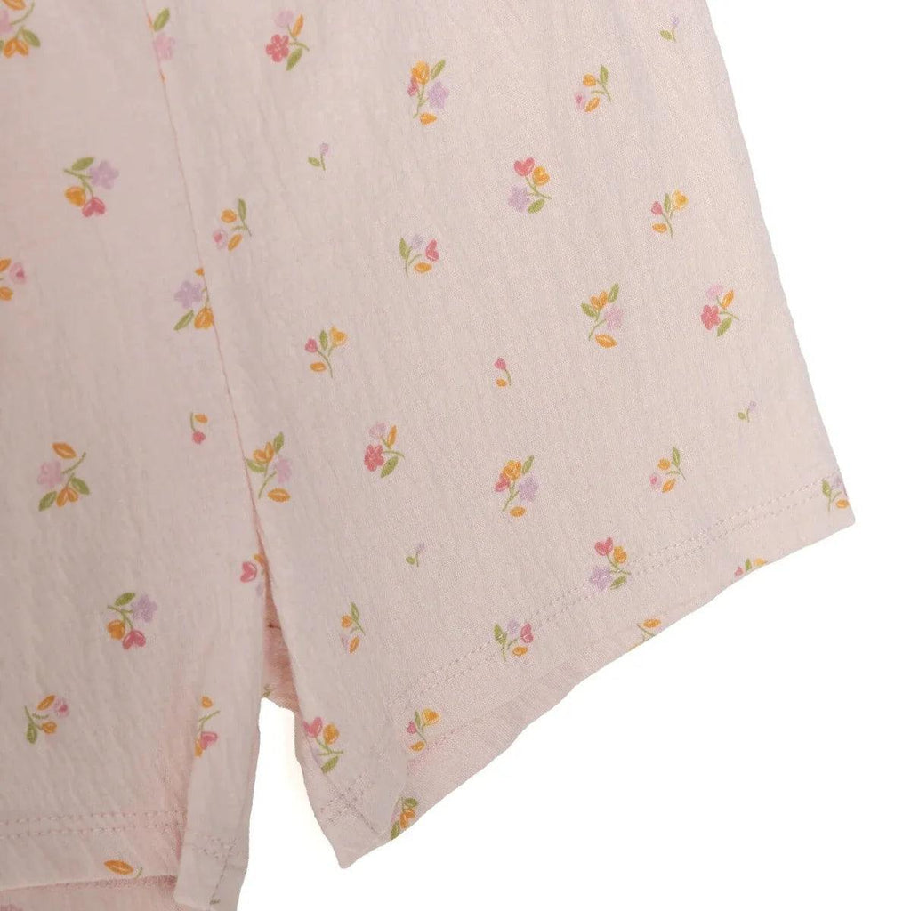 Pink floral baby shorts close-up, lightweight fabric and straight leg hem