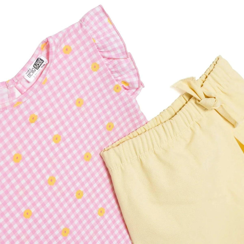 Pink gingham baby top and pale yellow shorts with bow-tied elastic waistband