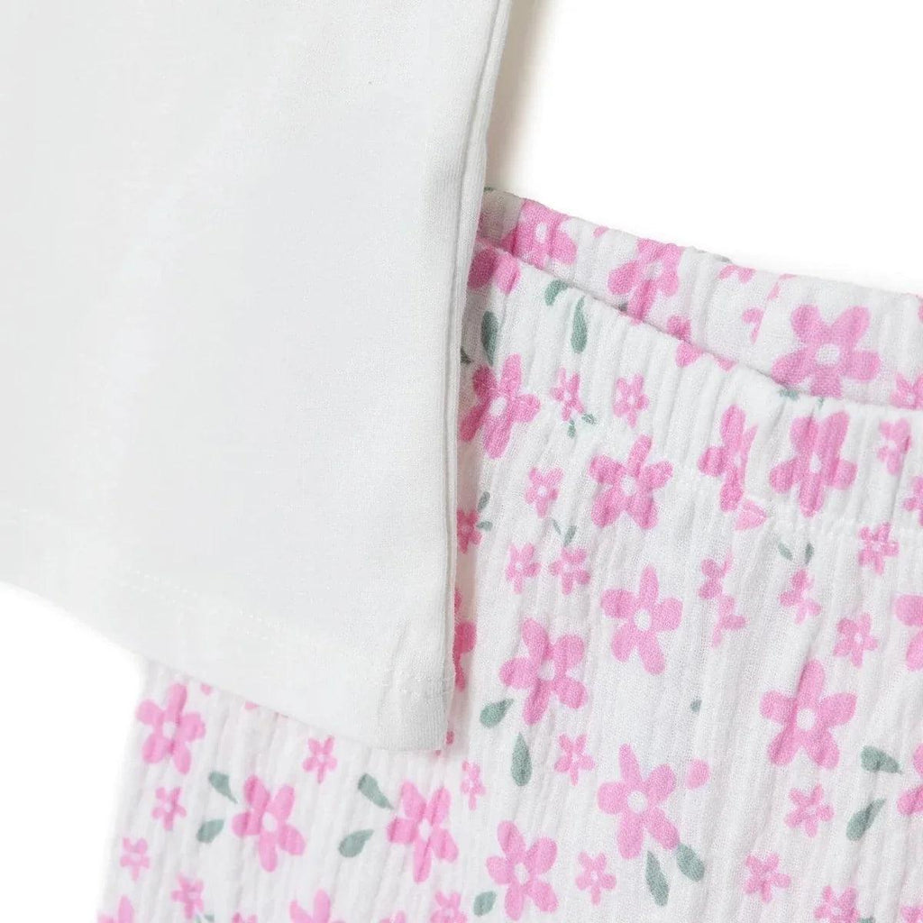 T-shirt hem with pink floral trousers waistband detail