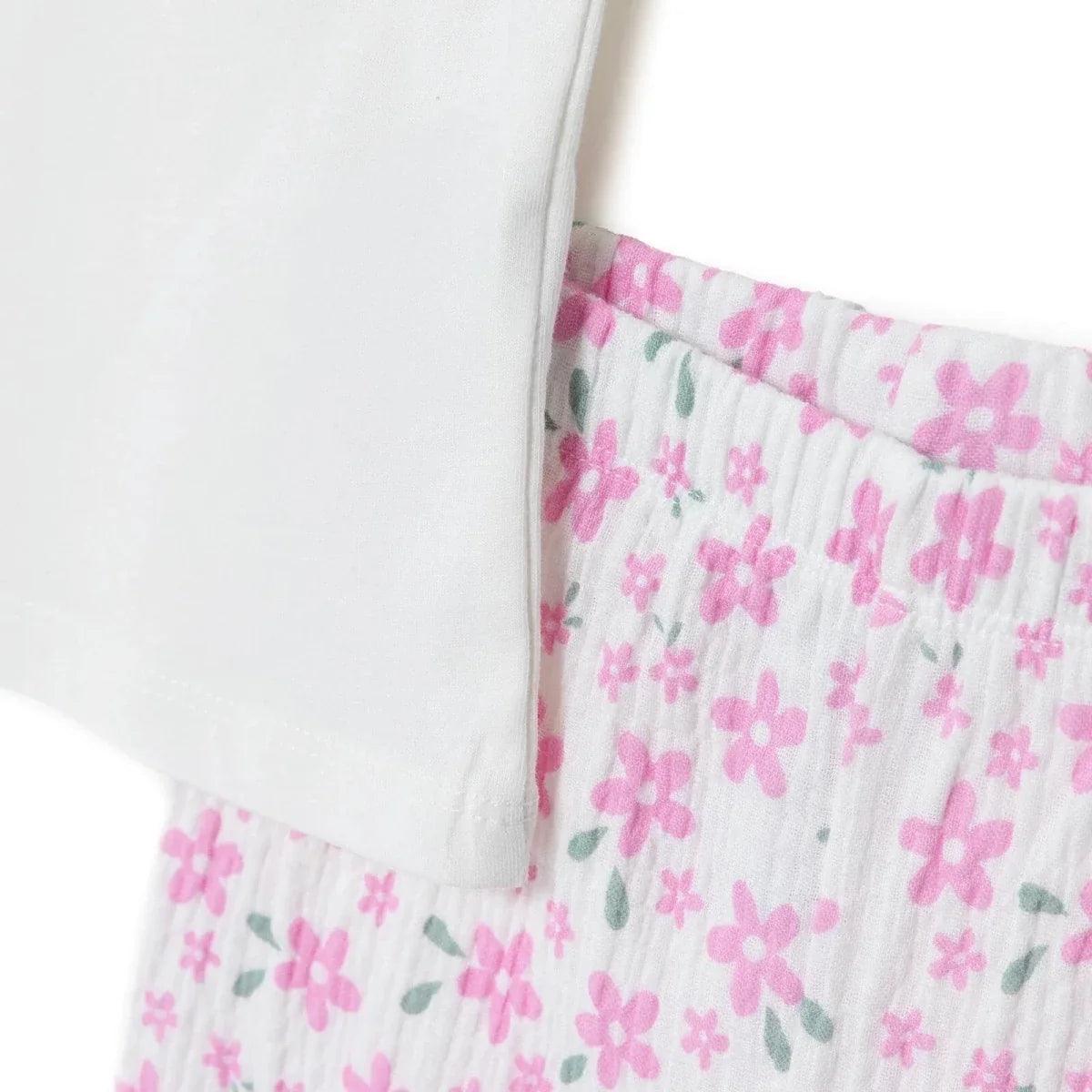 T-shirt hem with pink floral trousers waistband detail