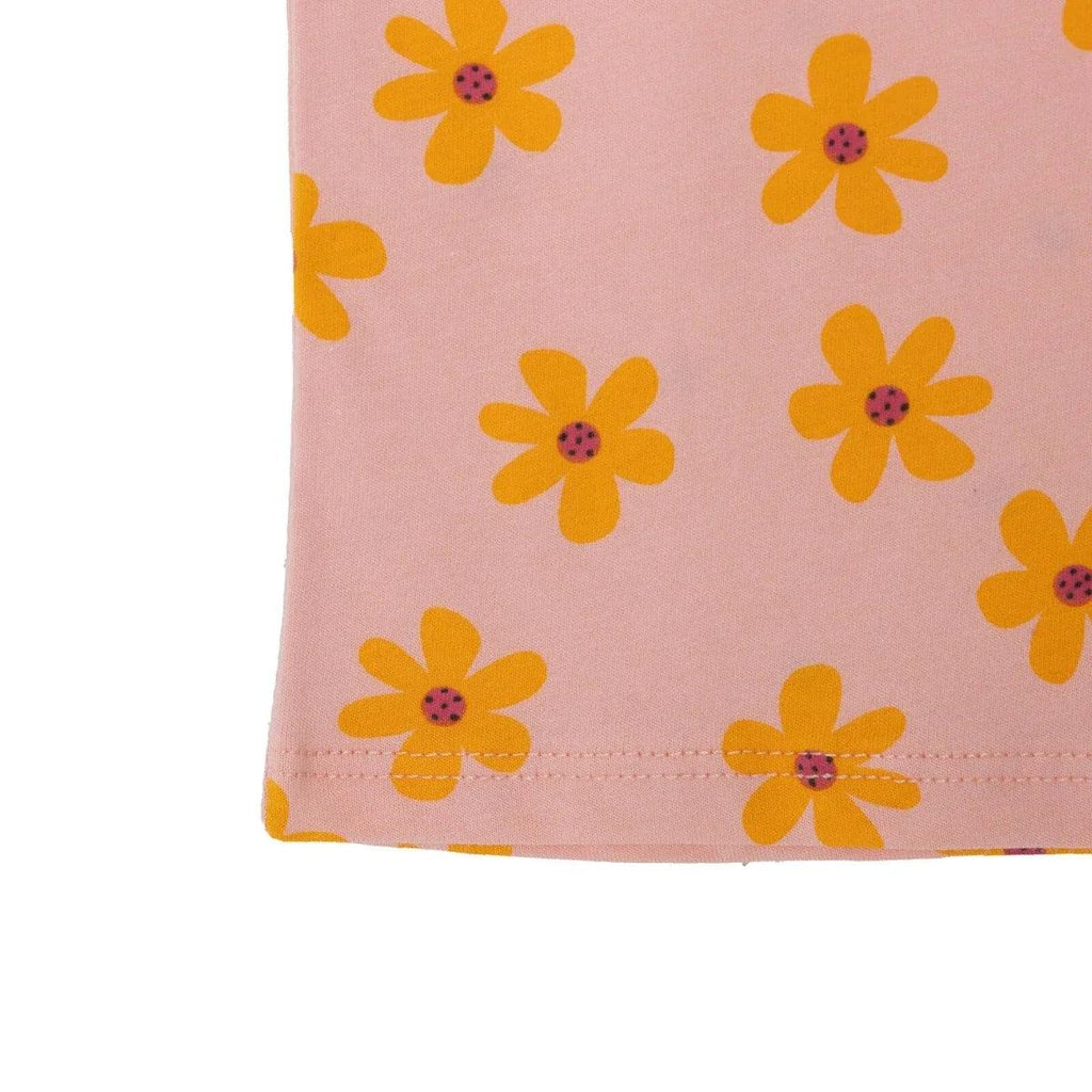 HelloBaby baby T-shirt hem close-up, salmon fabric with scattered orange-yellow flowers