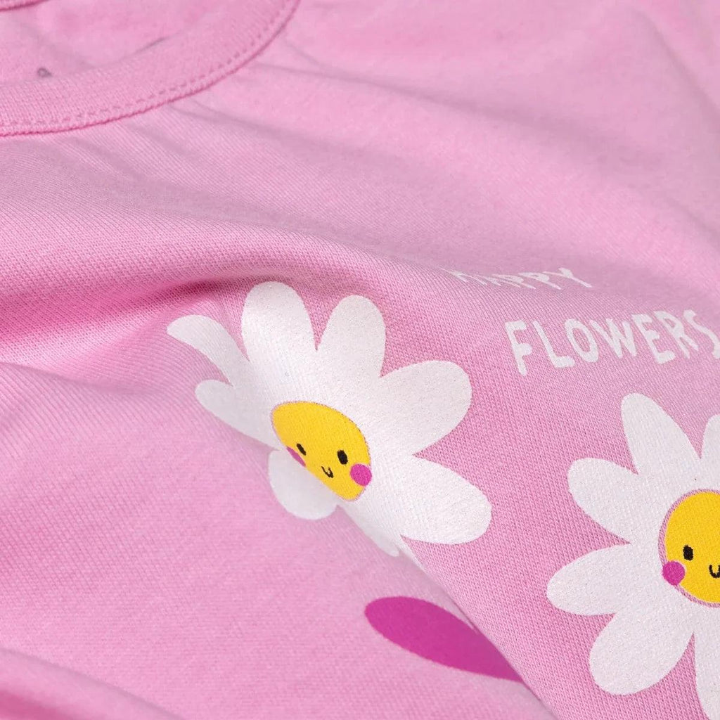Lilac baby T-shirt close-up with smiling daisy graphic