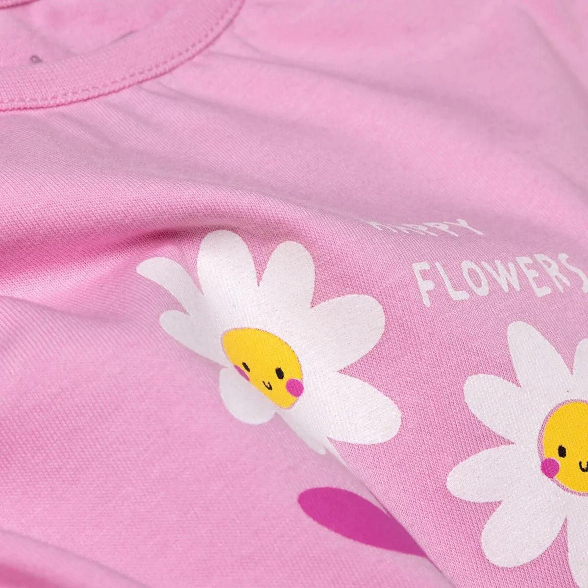 Lilac baby T-shirt close-up with smiling daisy graphic
