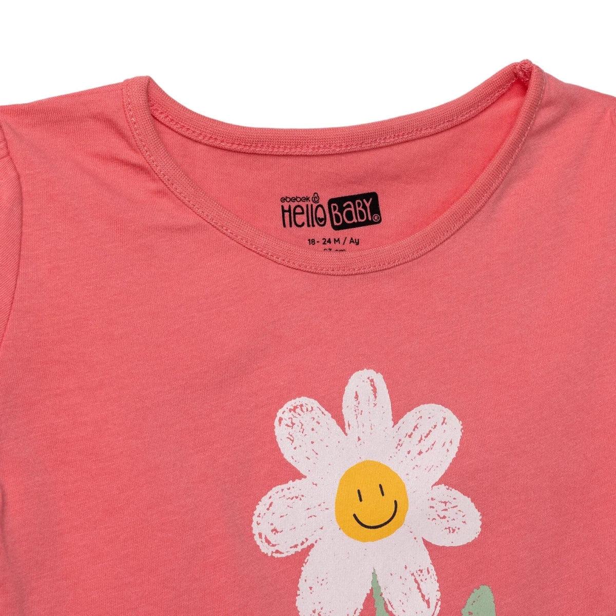 Coral baby T-shirt with HelloBaby neckline label and partial daisy smiley print