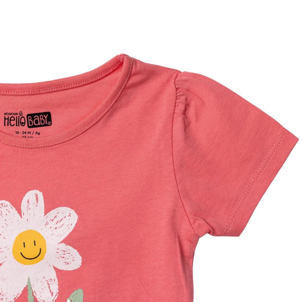 Coral baby T-shirt with short sleeves and stitched shoulder seam, partial daisy print