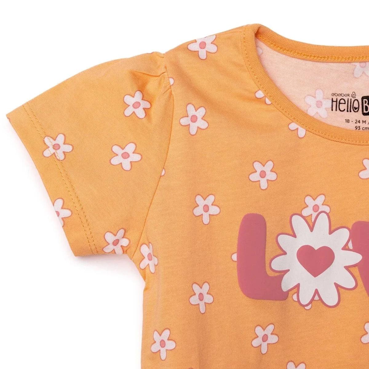 Salmon orange baby jersey T-shirt sleeve and shoulder detail with flower print