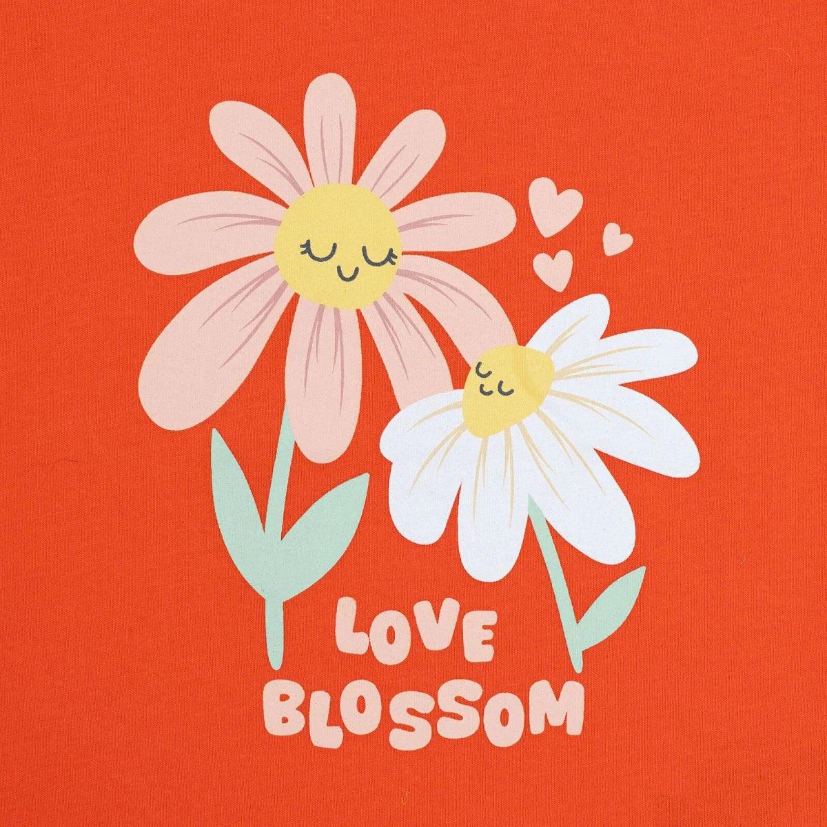 Coral baby jersey T-shirt with large daisy "Love Blossom" graphic
