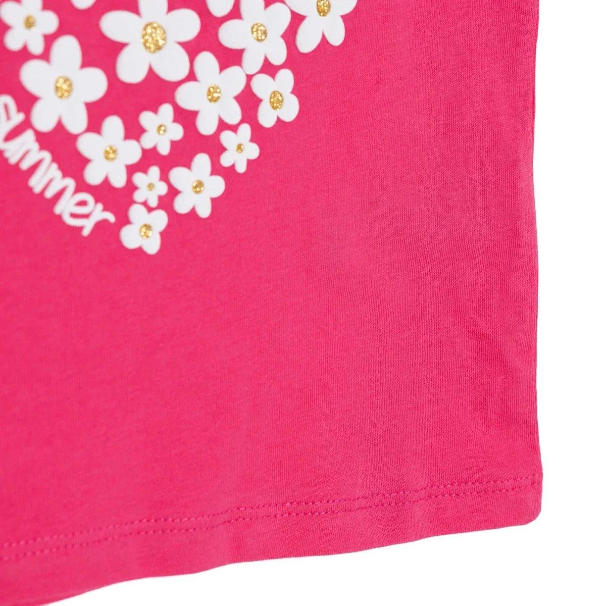Pink baby T-shirt hem and side seam, with floral heart graphic partly visible