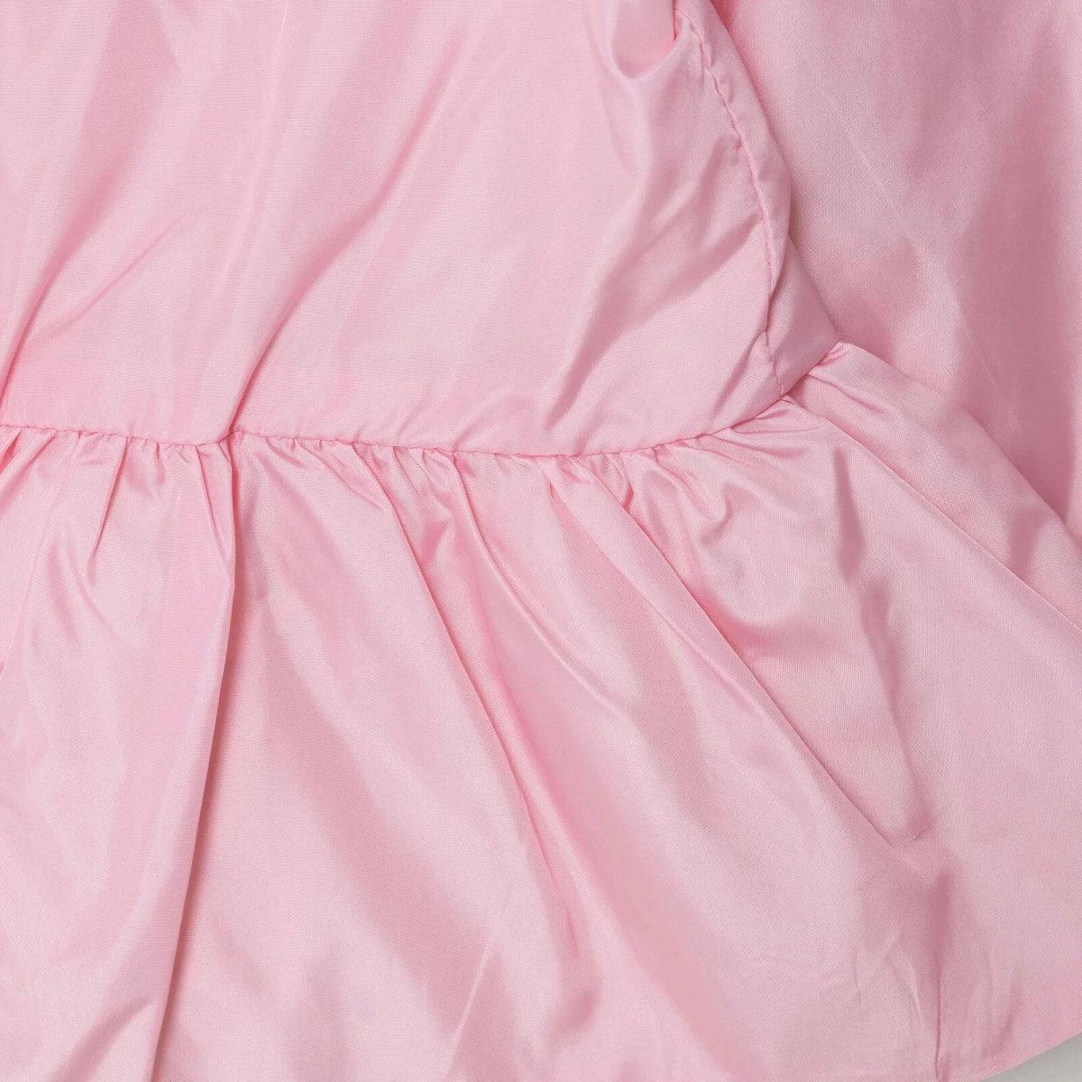 Pink baby raincoat ruffled peplum hem detail
