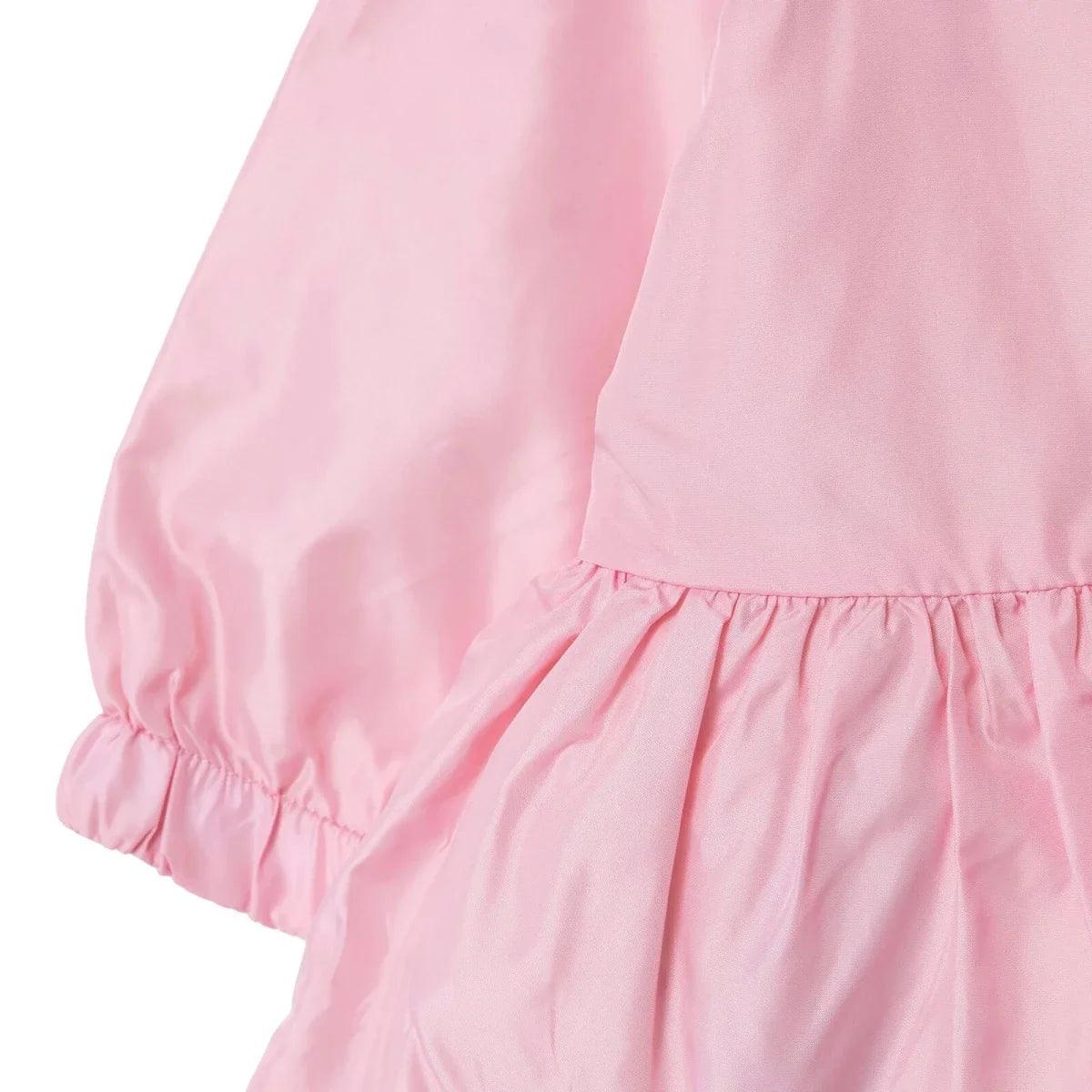 Pink baby raincoat sleeve with elastic cuff and gathered peplum