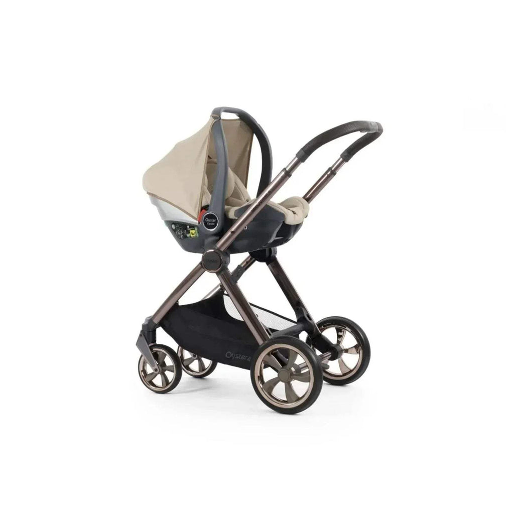 Buttermilk stroller with carrycot insert and black frame, side view