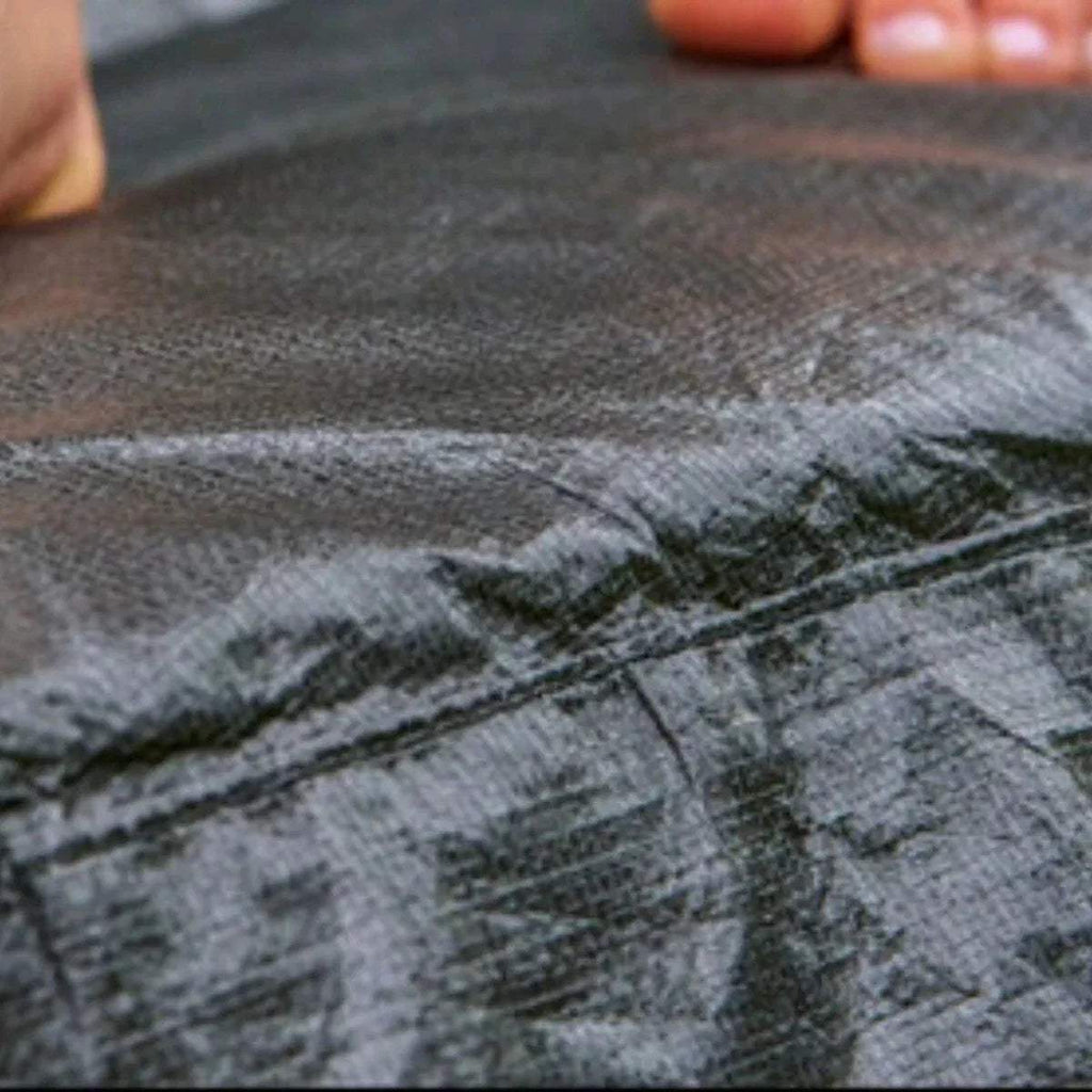 Trampoline jumping mat close-up, dark gray textured fabric surface