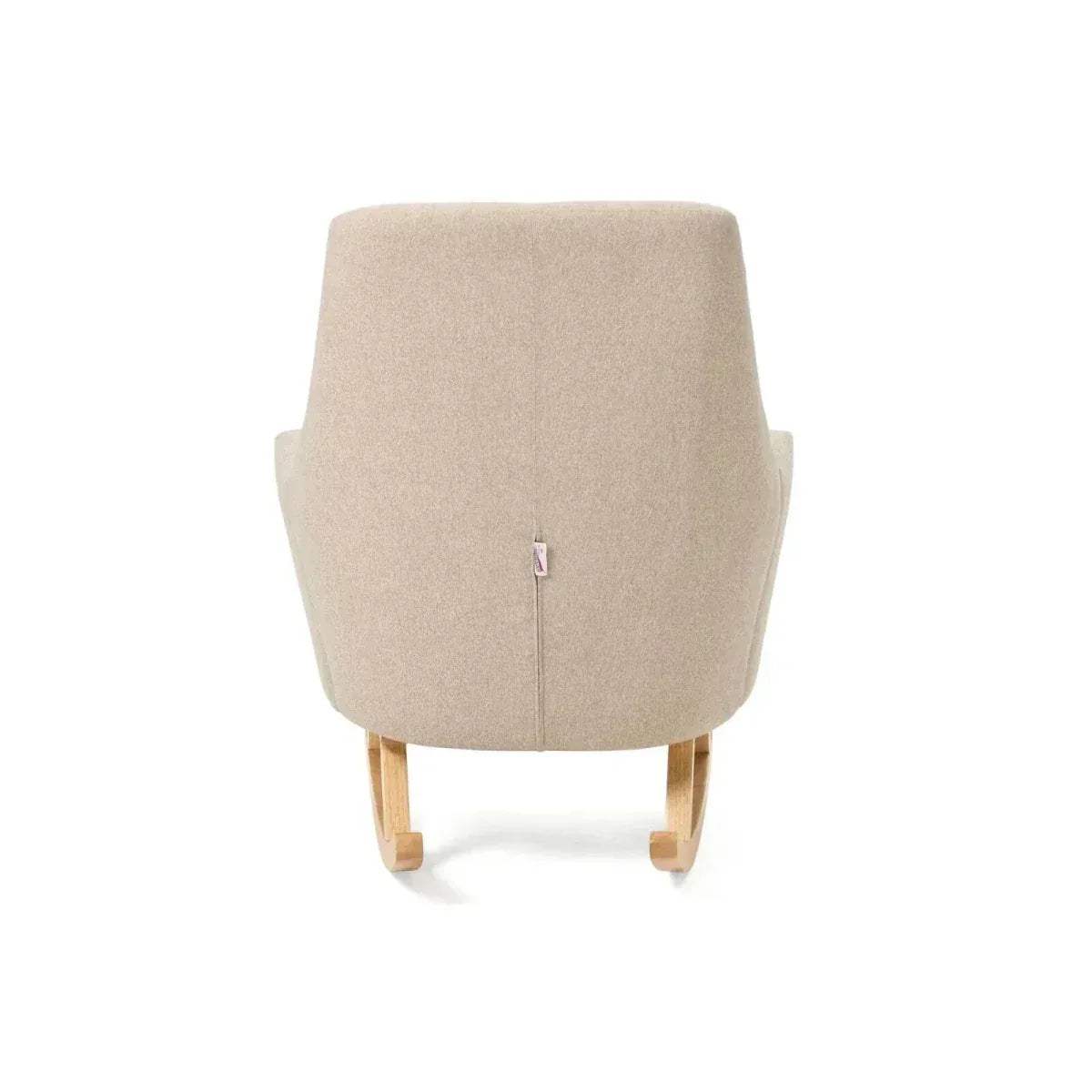 Stone upholstered rocking chair front view with vertical tuft seam and wood runners.