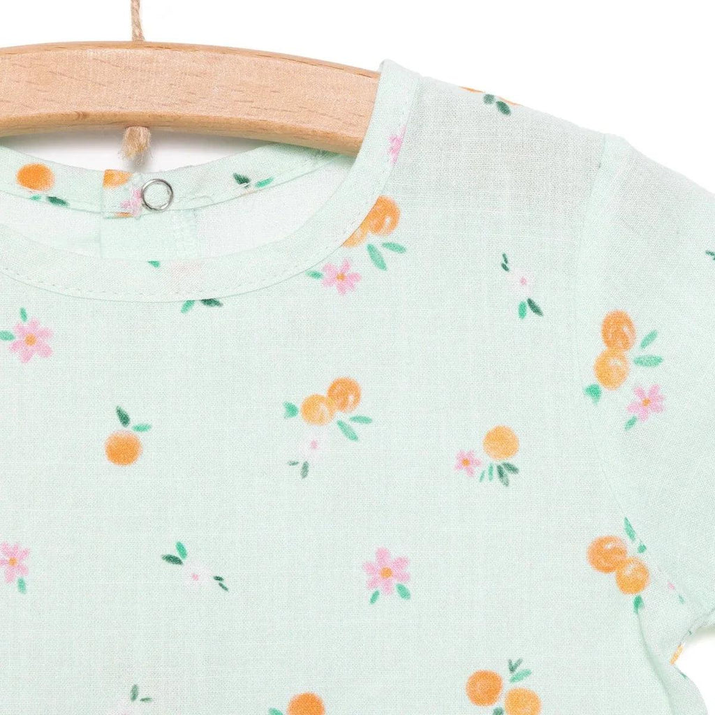 Light blue floral-print dress neckline with keyhole button placket at back