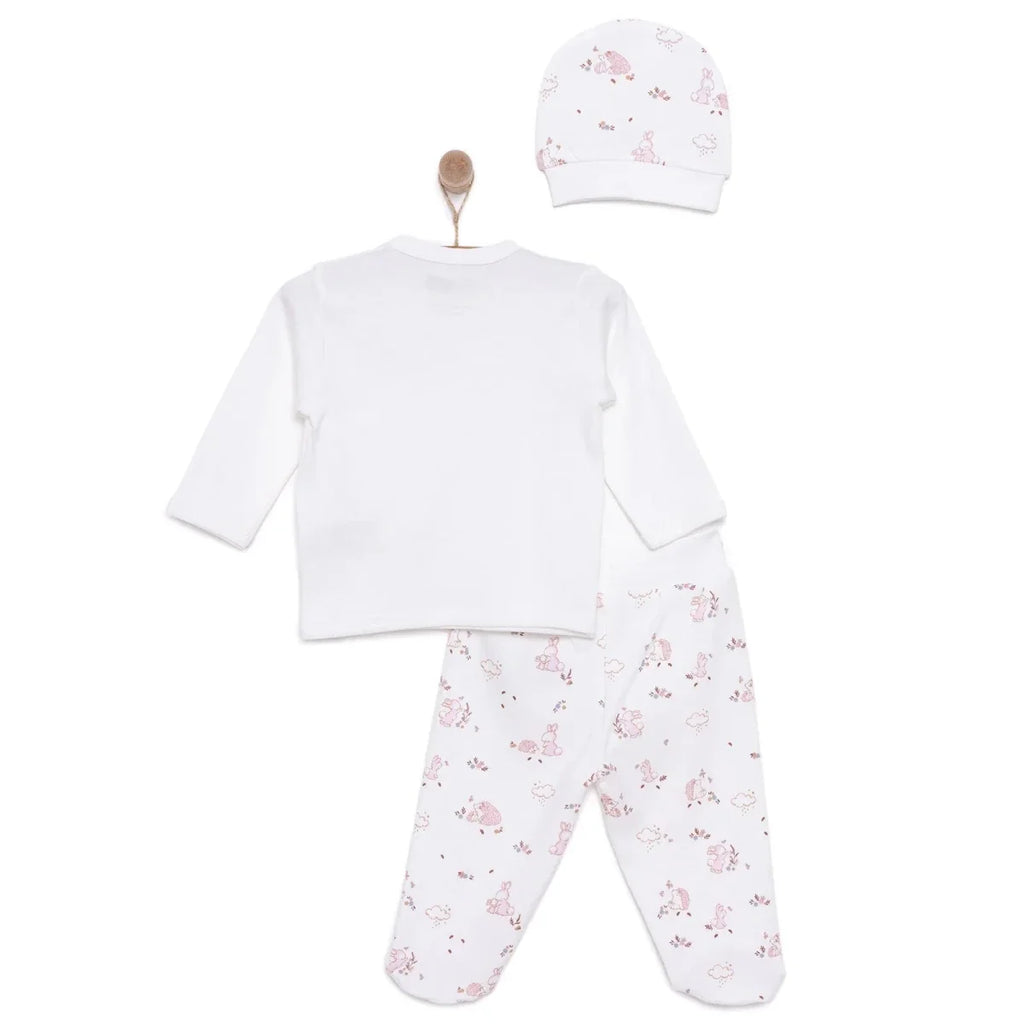 Newborn baby girl set in ecru from back: long-sleeve top and printed pants with hat