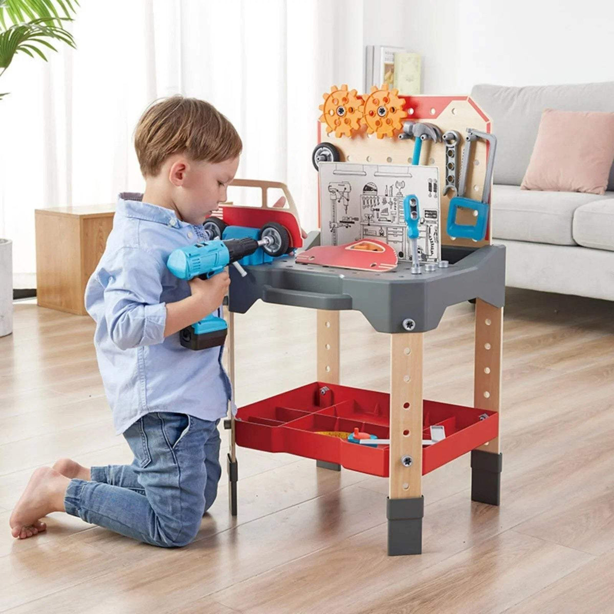 Hape vehicle service and repair workbench with colorful car and child holding toy tool