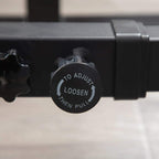 Black adjustment knob dial on the multifunction strength rack frame