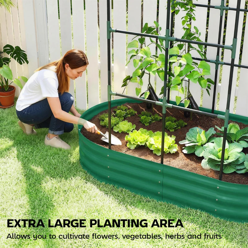Green raised garden bed with arched trellis, gardener planting vegetables in soil
