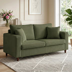 Green corduroy two-seat sofa with square arms and tufted back cushions