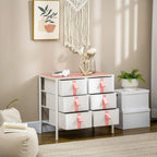 Pink-topped fabric drawer storage cabinet with 6 drawers and pink tab handles, decor on top