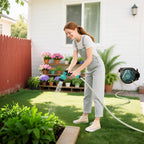 Wall-mounted hose reel dispensing water with retractable white hose