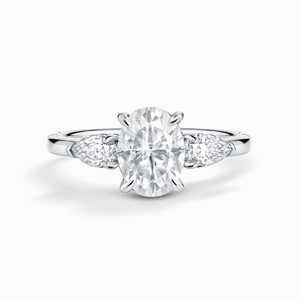 Three-stone oval moissanite engagement ring in sterling silver, bright clear stones