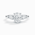 Three-stone oval moissanite engagement ring in sterling silver, bright clear stones