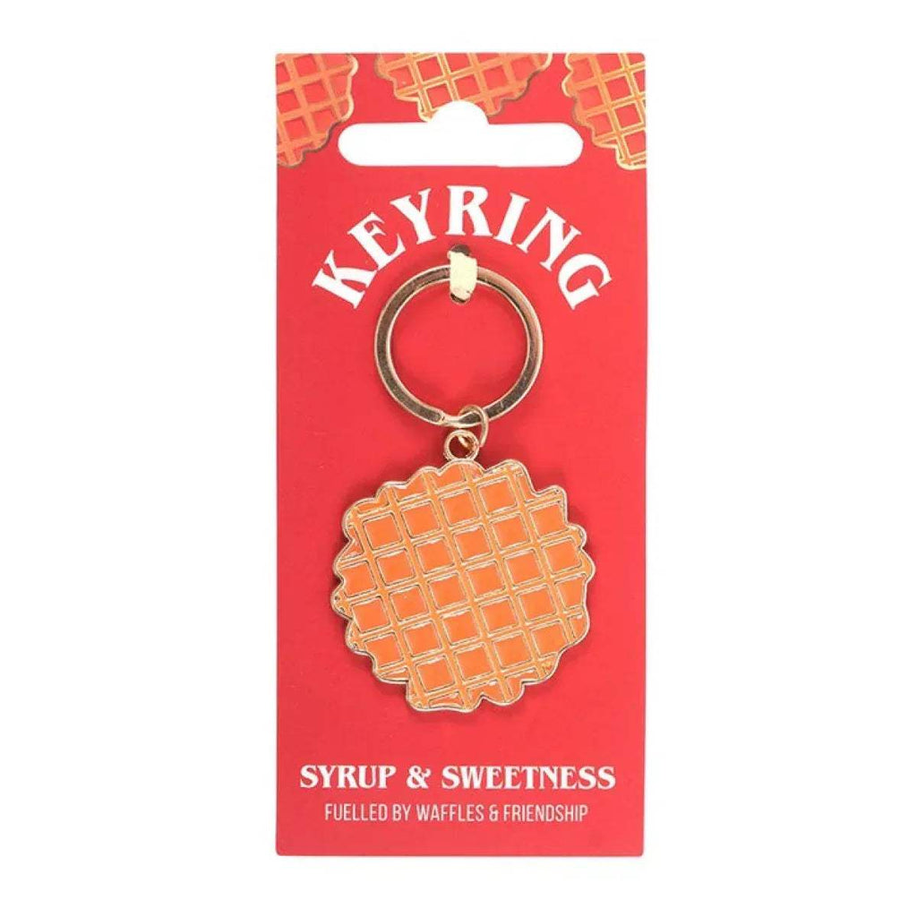 Waffle-shaped keyring charm with orange grid waffle and metal ring on card