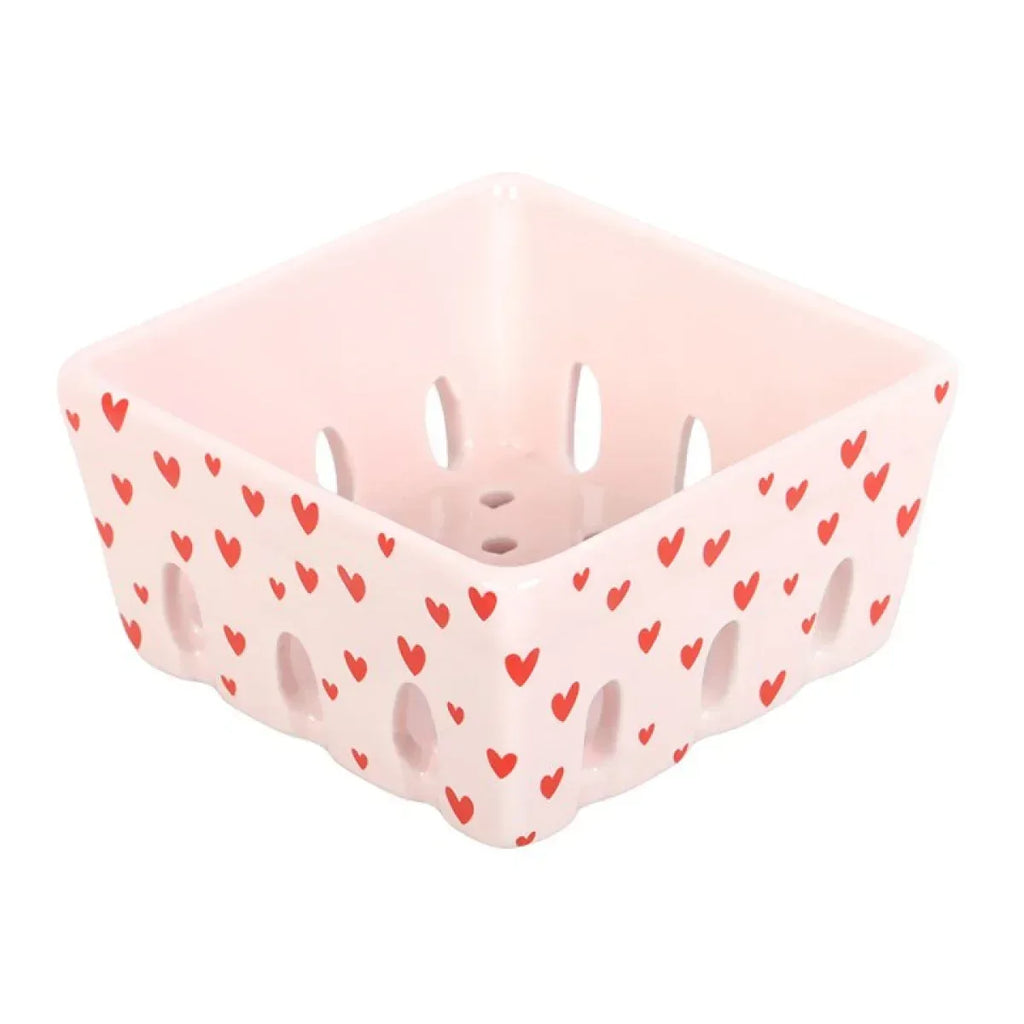 Pink ceramic berry basket with red heart print and open handle cutouts